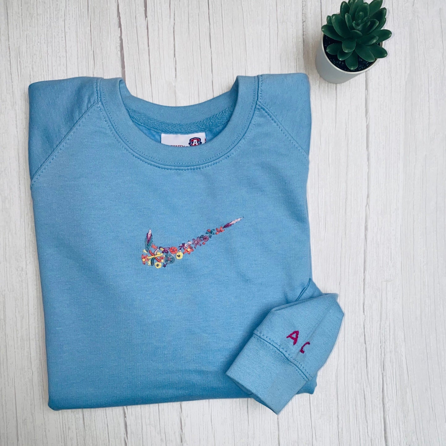 Beautiful Adults hand embroidered floral sweatshirt.