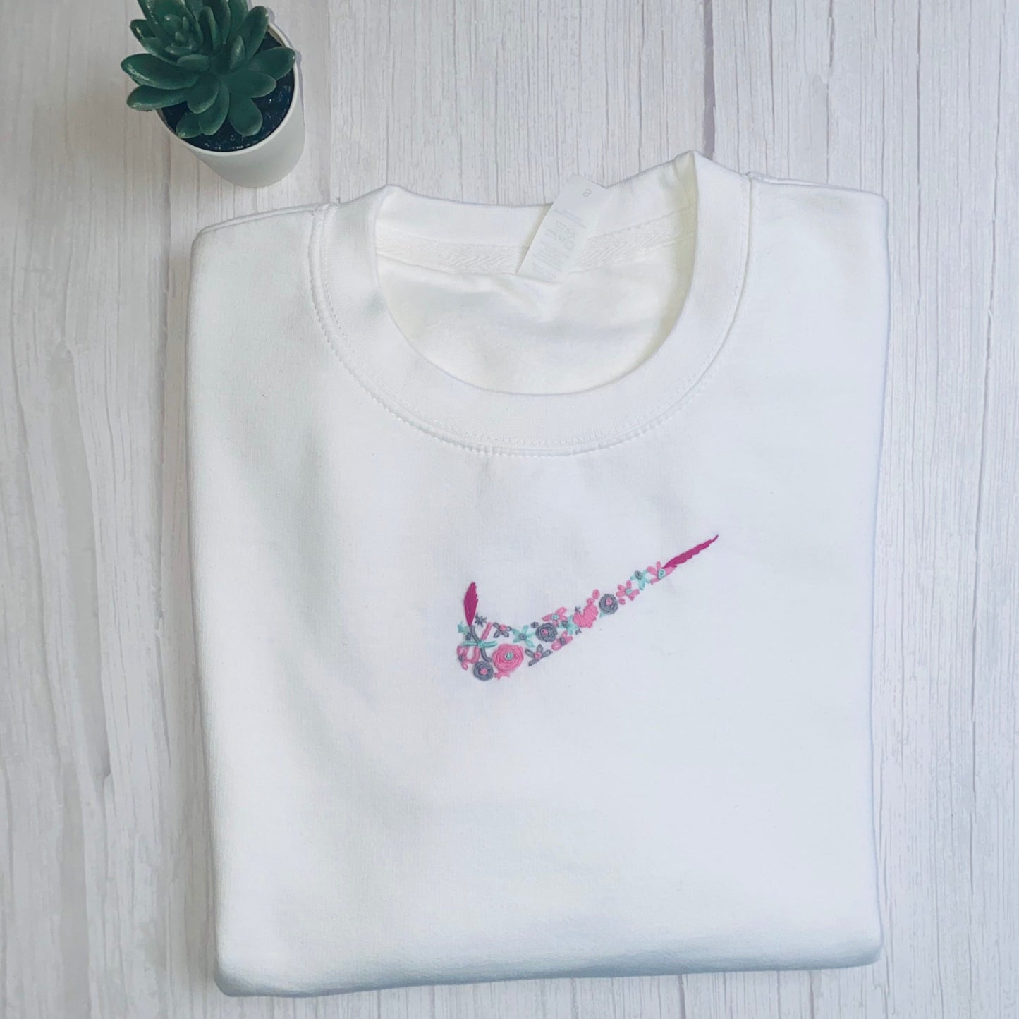 Beautiful Adults hand embroidered floral sweatshirt.